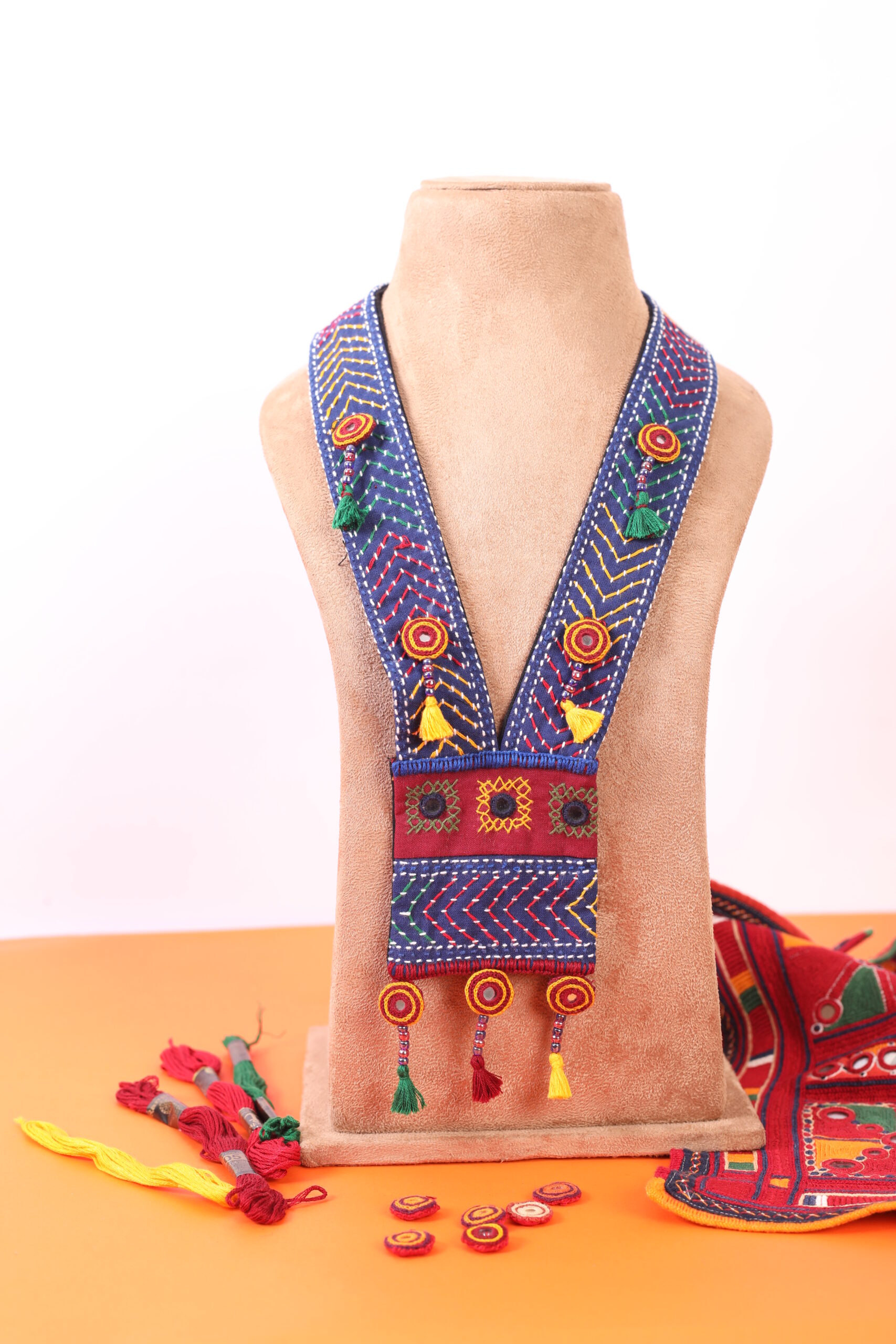 handcrafted embroidered long pendant necklace with tassel detailing