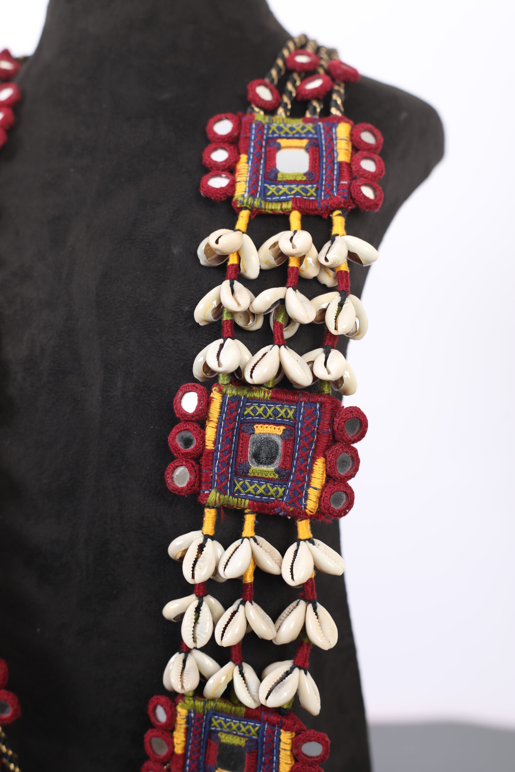 handcrafted Gormaati layered long necklace with mirror panels and shell tassels
